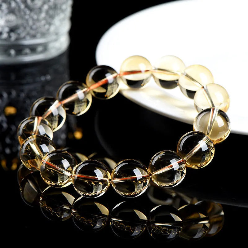 Natural citrine scattered beads bracelet showing polished yellow gemstones on a string, available in multiple bead sizes.
