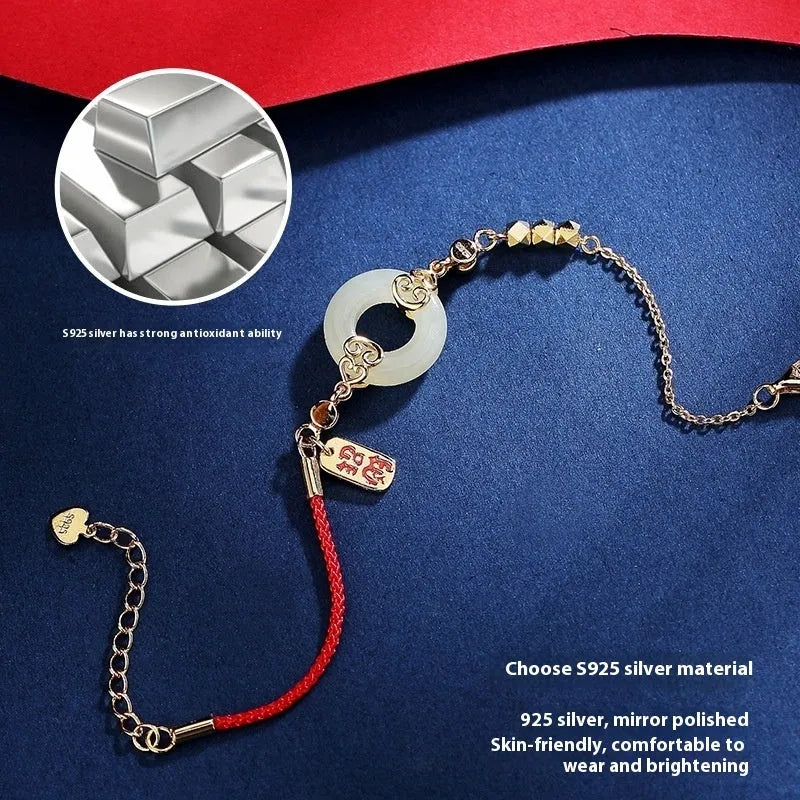 Women's sterling silver jewellery set with gourd bracelet, Fu necklace, and earrings featuring inlaid Hetian jade.