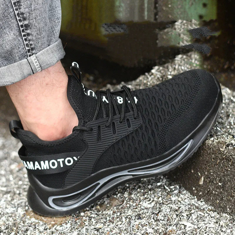 Black ultra-light steel toe anti-piercing work shoes with fly woven upper and low-top design on a white background