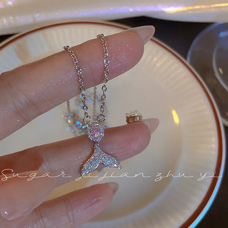 Women's sterling silver necklace showing Angel Wings and Fishtail pendant options on an adjustable O-ring chain.