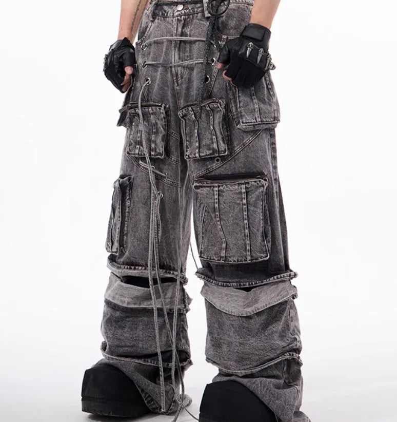 Grey distressed denim overalls with rope stitching on a hanger