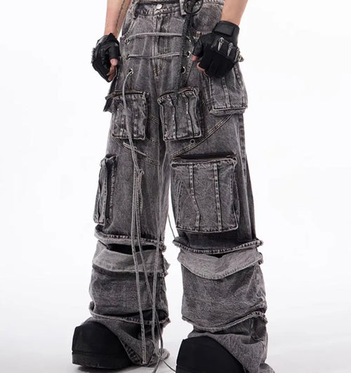 Grey distressed denim overalls with rope stitching on a hanger