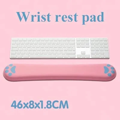 Cat's Claw cartoon design memory foam keyboard wrist rest pad in blue, shown on a desk.