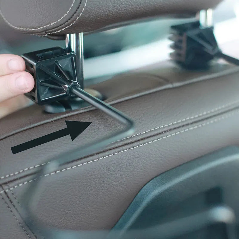 Black metal snap-on hat bracket for car interior display stand holding a hat