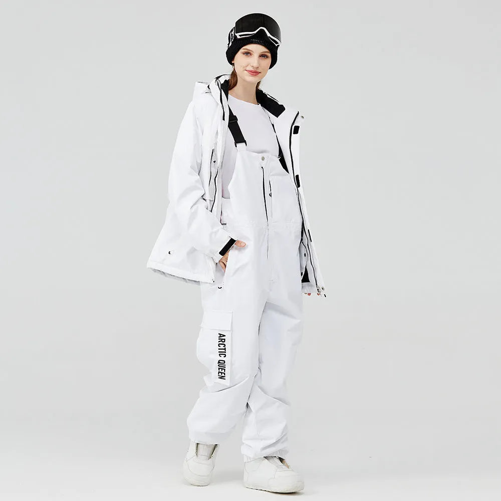 Man and woman modelling a blue and black waterproof ski suit for winter snow sports.