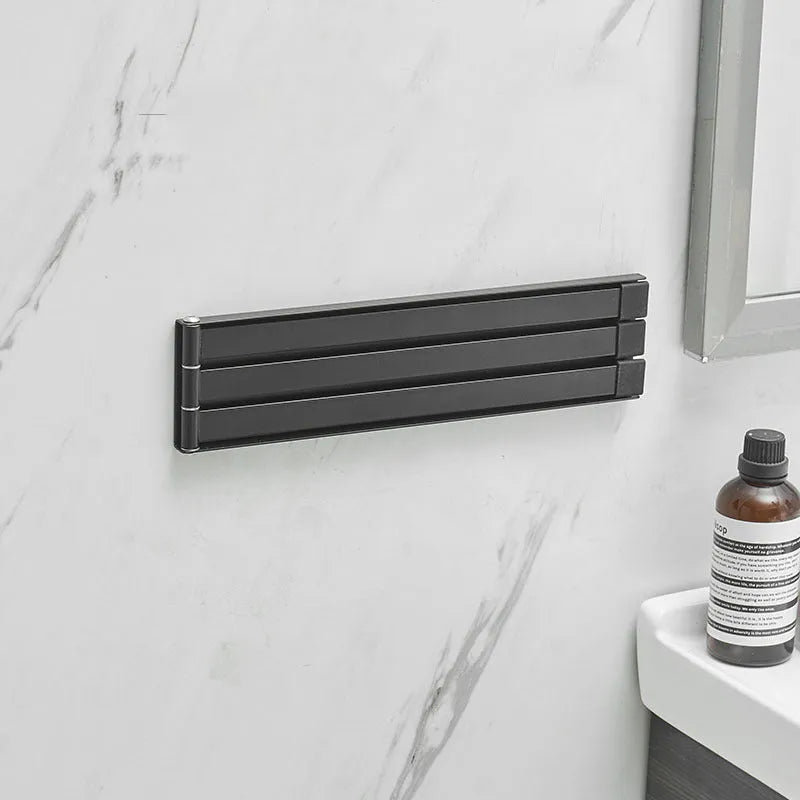 Black folding towel bar with no-drill installation for bathroom towel storage