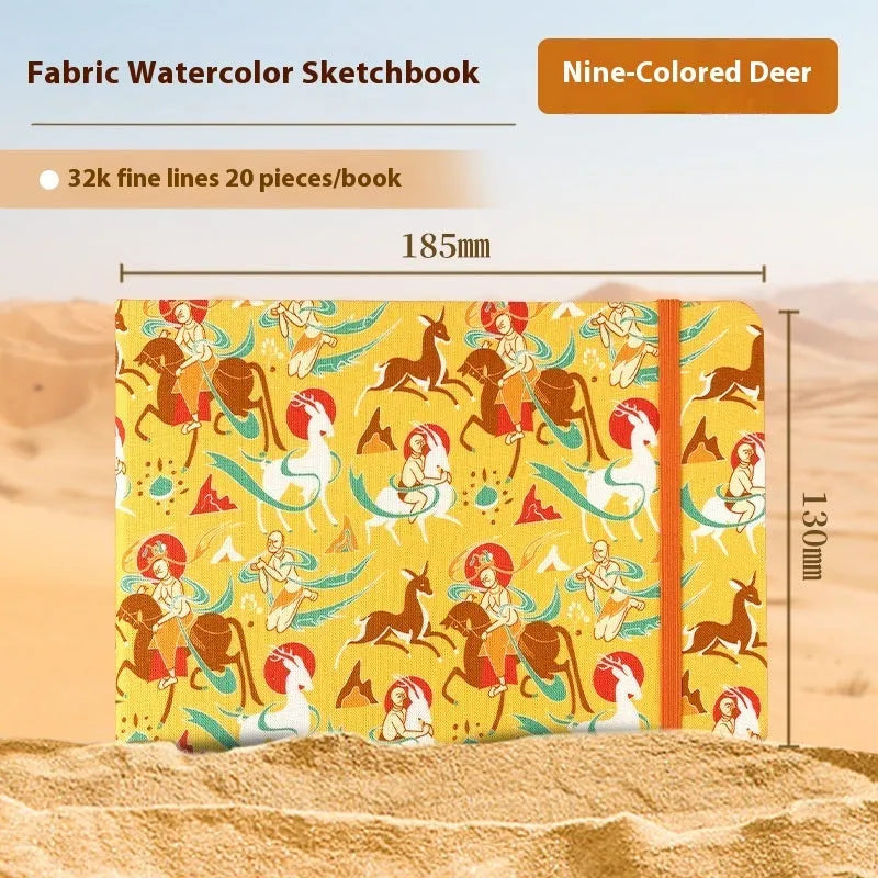 Feiluniao handmade fabric watercolour notebook with illustrated cover, open to show blank paper pages.
