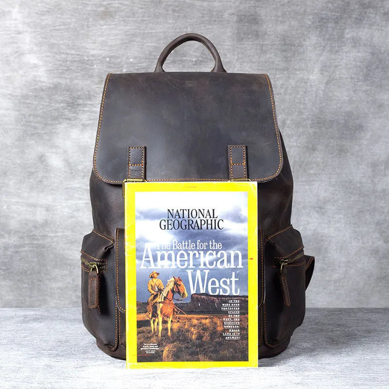 Brown genuine cowhide leather backpack with double shoulder straps and soft handle