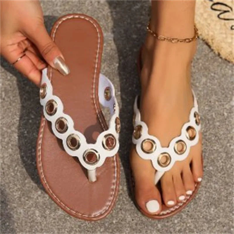 Metal hollow circle design thong sandals in rose red with plastic upper and flat rubber sole