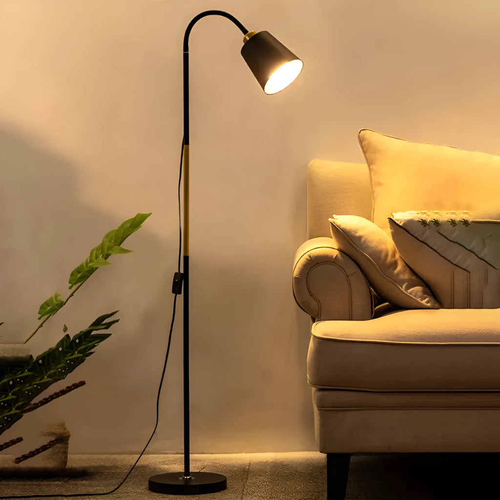 Nordic style black and gold floor lamp with eye-protection LED light next to a sofa.
