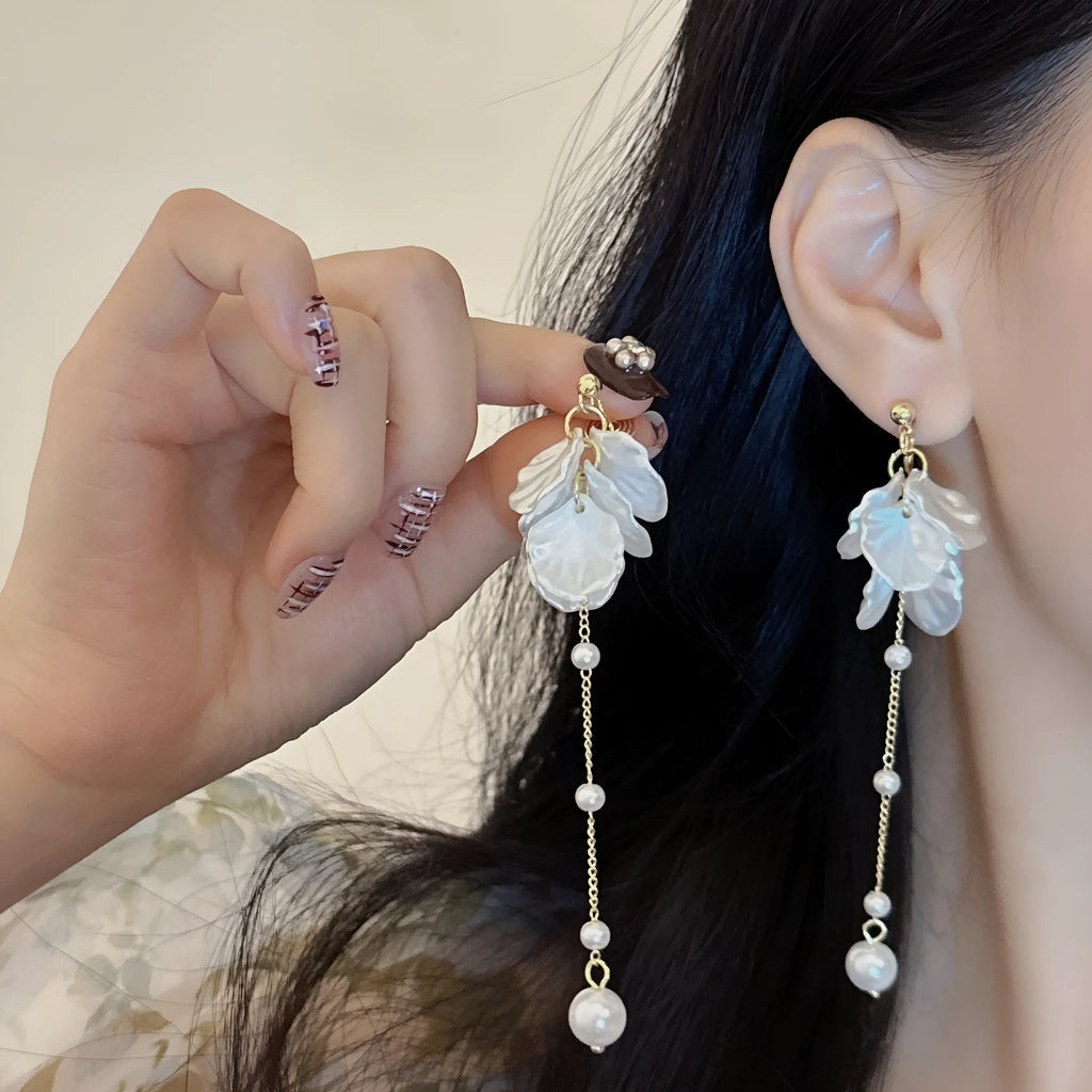 Women's acrylic shell pearl tassel clip earrings with four clip options showing 8.8cm length