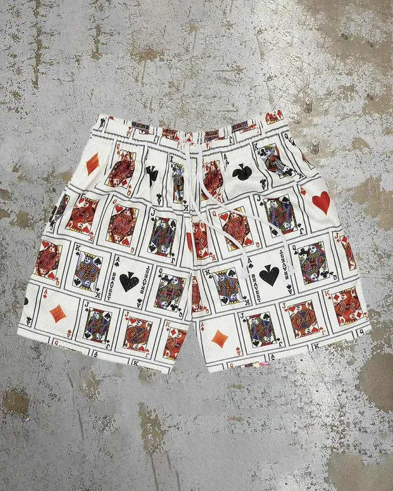 Man wearing loose-fitting digital print beach shorts made from quick-drying milk silk polyester.