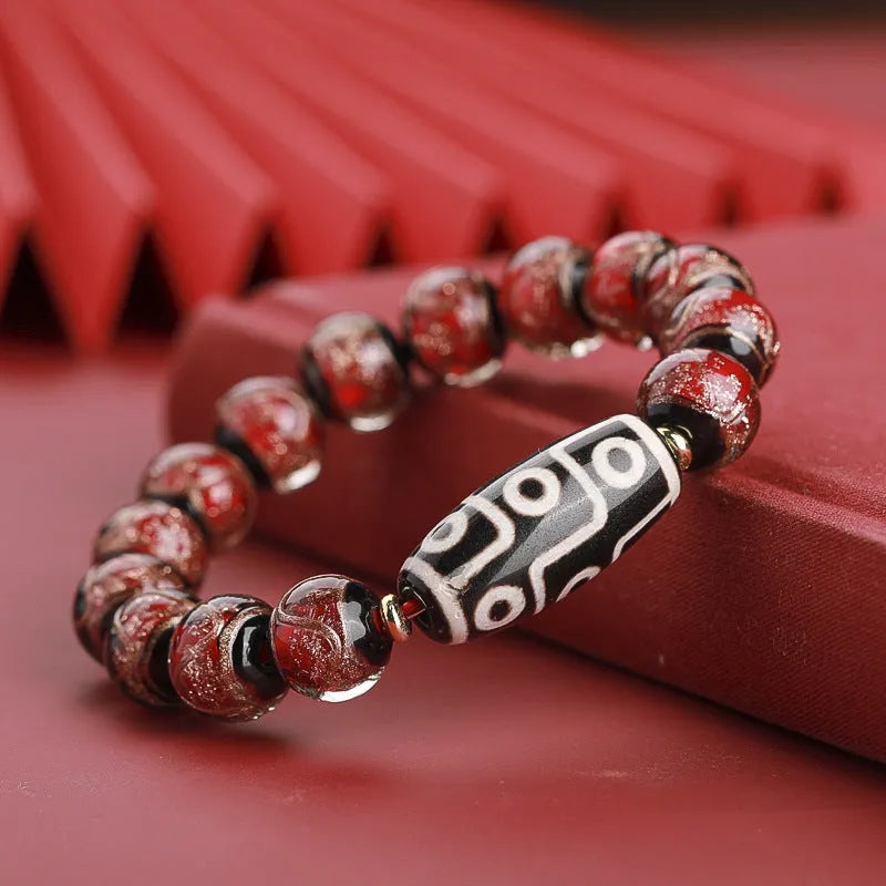 Chinese-style five-colour lucky snake bead bracelet made from coloured glaze, showing auspicious patterns.