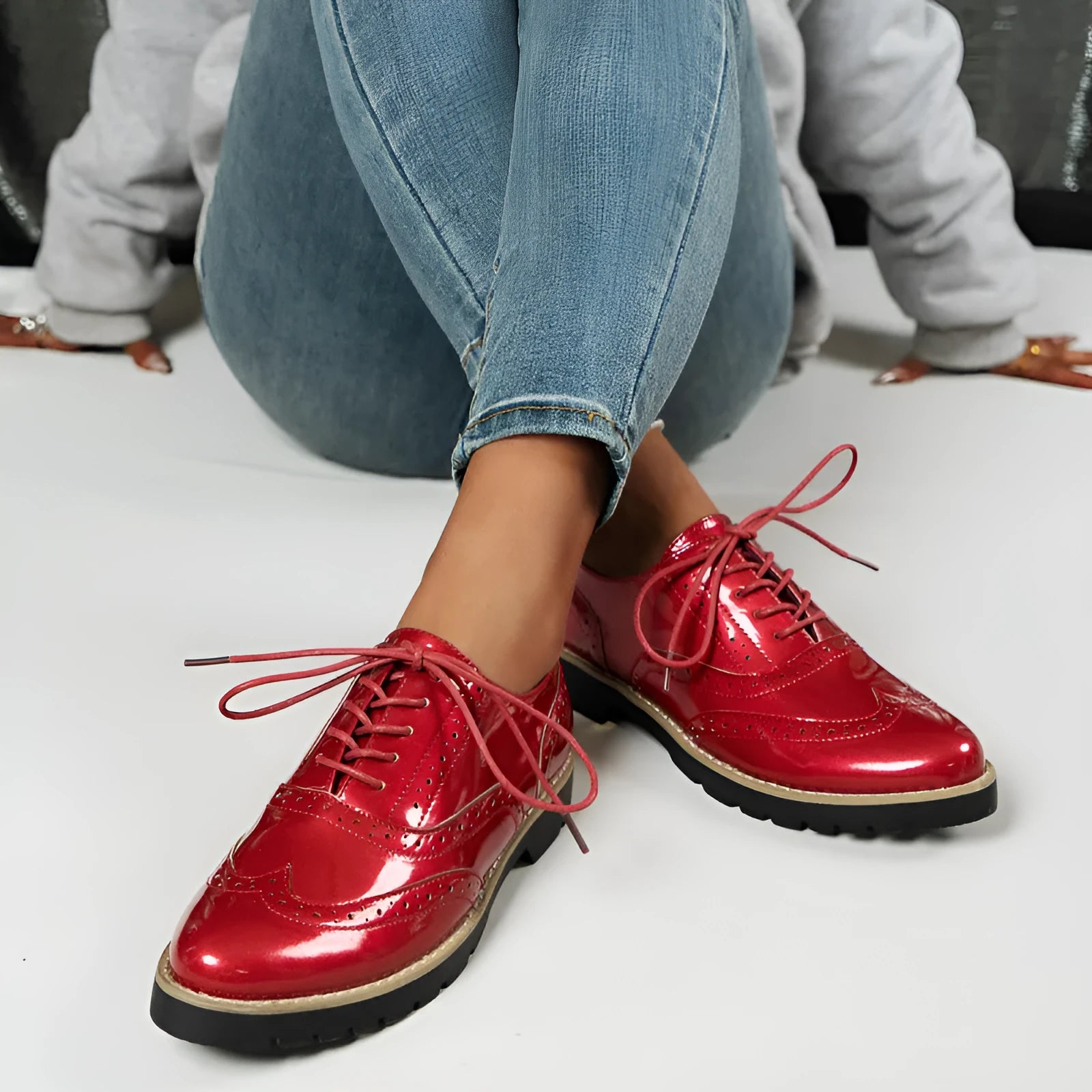 Women's black oxford shoes with wedge heel and sequin detailing, showing round toe and middle mouth cut
