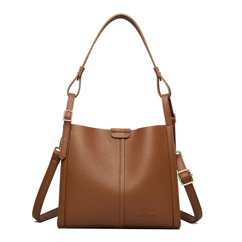 Brown retro ladies shoulder bag with zip compartments showing vertical square shape and single strap