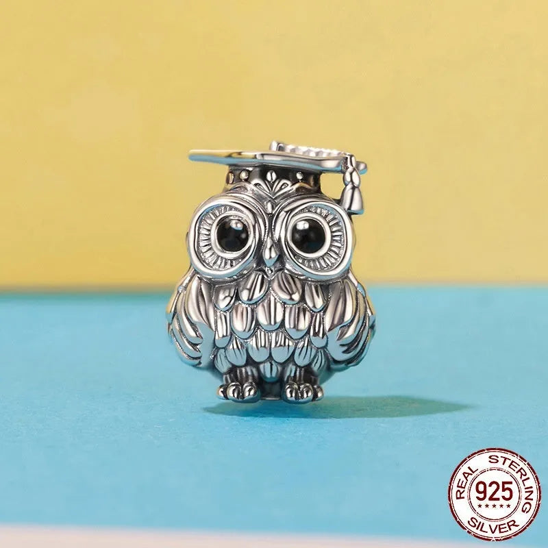 Silver S925 sterling silver owl bead with drip oil finish on white background