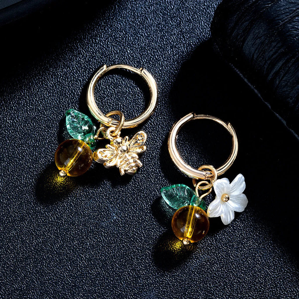 Sweet alloy and glass bee pendant ear cuff with flower and leaf motifs for women