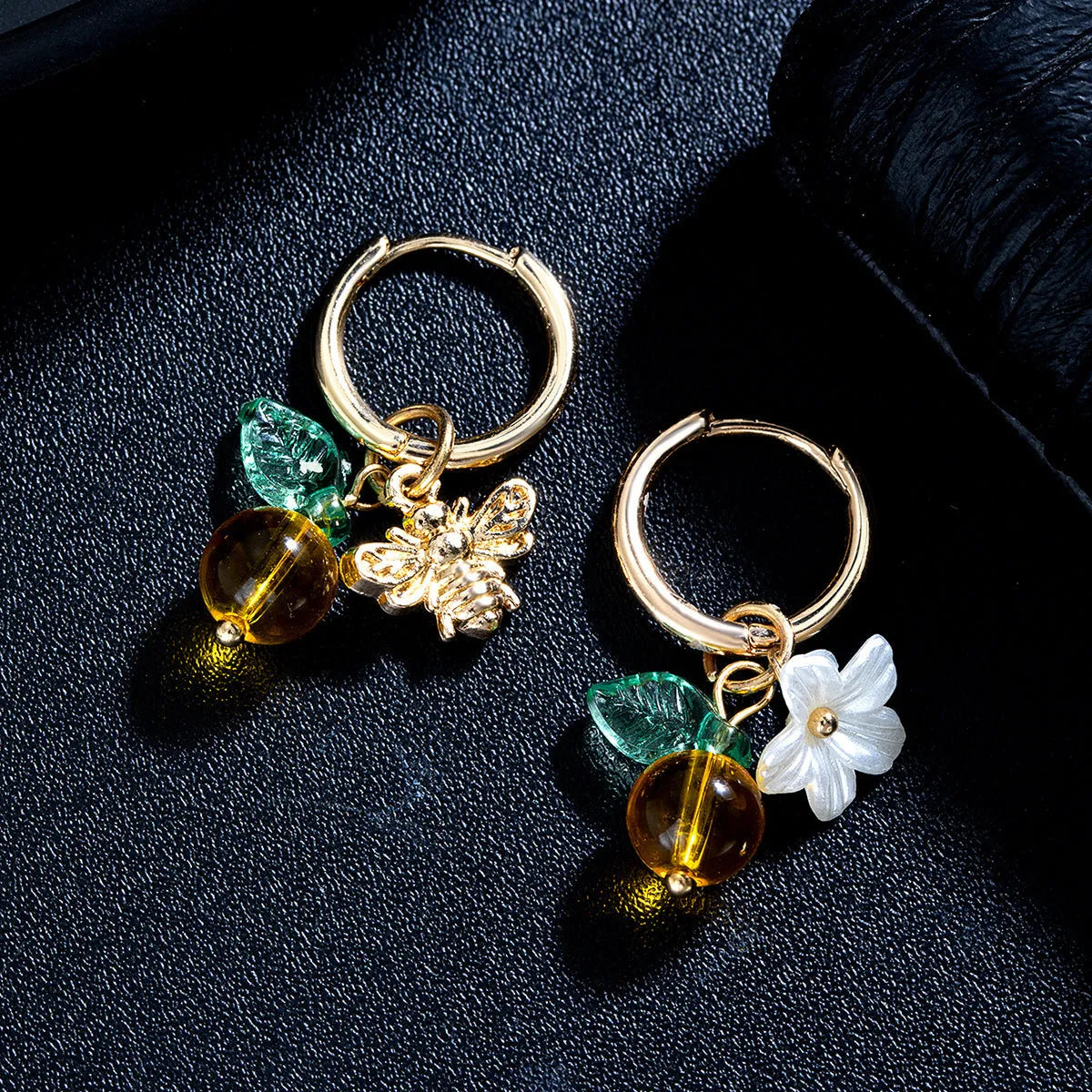 Sweet alloy and glass bee pendant ear cuff with flower and leaf motifs for women