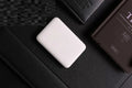 Portable mini 5000 mAh mobile power supply in black with multi USB port output
