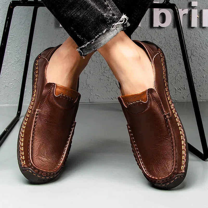 Men's leather casual shoes in black with round toe, shallow opening, and rubber sole