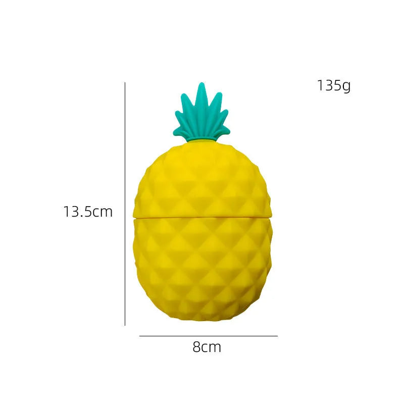 Silicone facial ice mold in pineapple style, pink colour, with ice cubes on a white background
