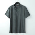 Loose women's cotton V-neck short sleeve top in apricot colour on a hanger