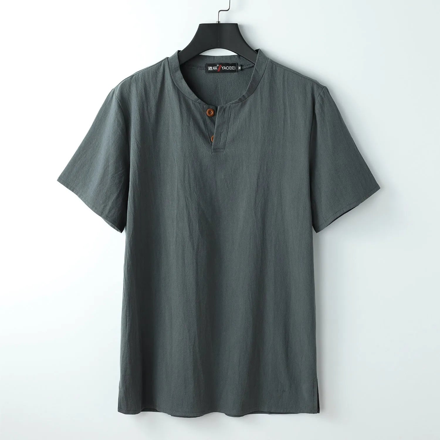 Loose women's cotton V-neck short sleeve top in apricot colour on a hanger