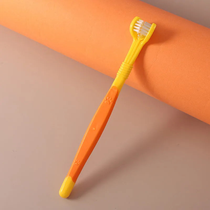 Pet toothbrush with nylon bristles and plastic handle in green colour