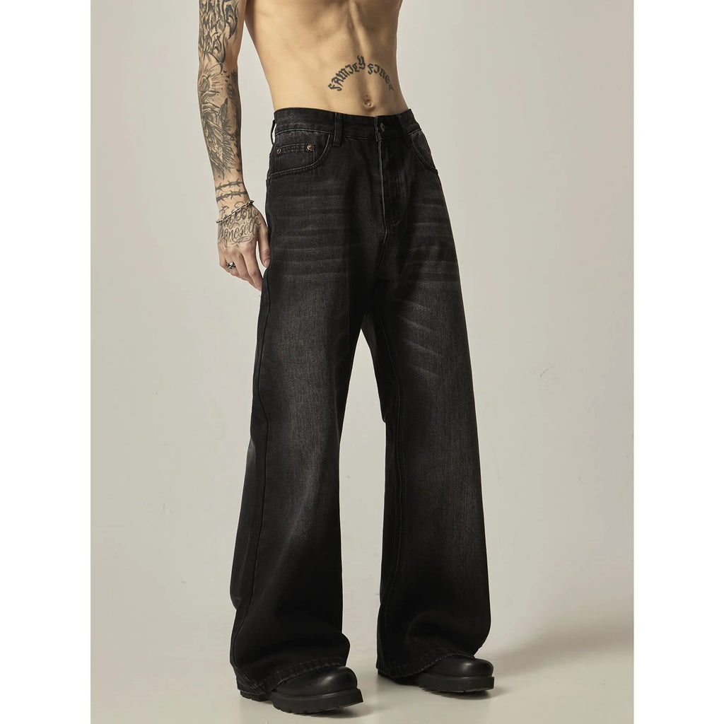 Black loose straight retro jeans with zipper fly closure on plain background