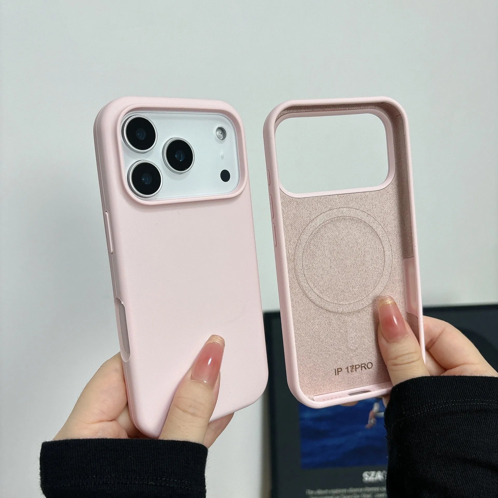 Liquid silicone magnetic iPhone case with Ai button in antique white colour on a table.
