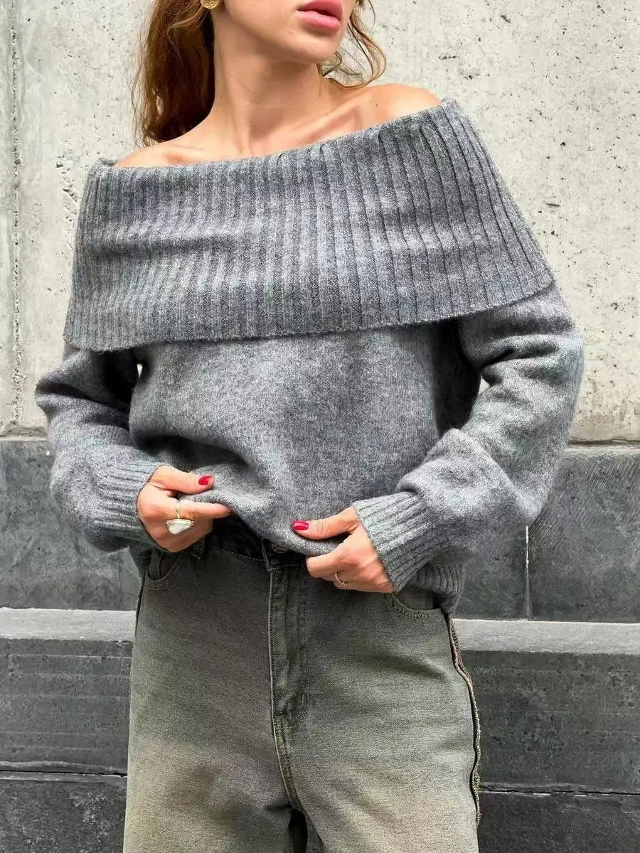 Grey off-the-shoulder strapless women's sweater with a 3D textured pattern.