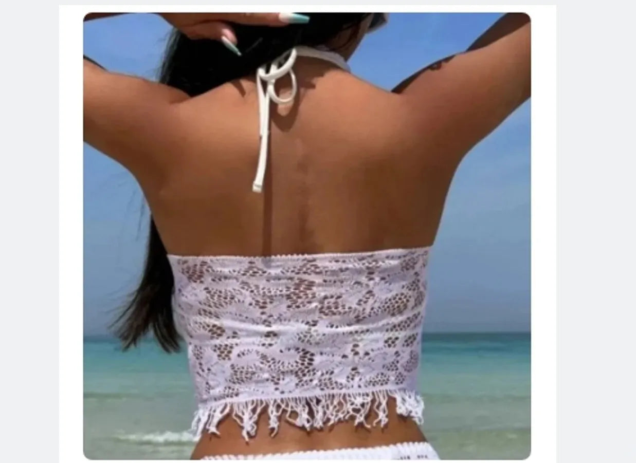 Women's two-piece bikini swimsuit with lace detail and attached tassel skirt cover-up in black or white
