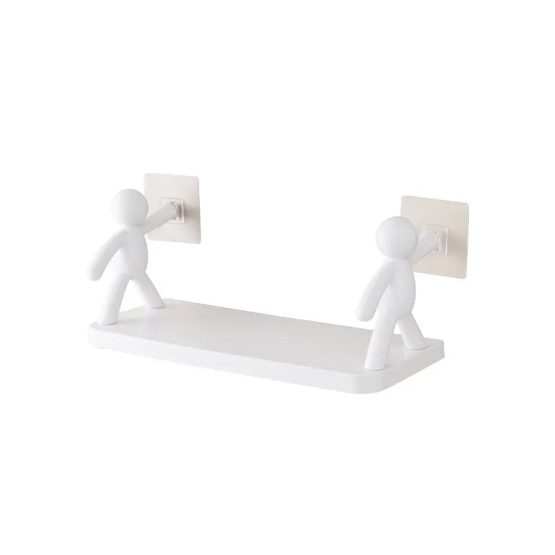 White plastic wall-mounted storage shelf in little man doll design on a bathroom wall