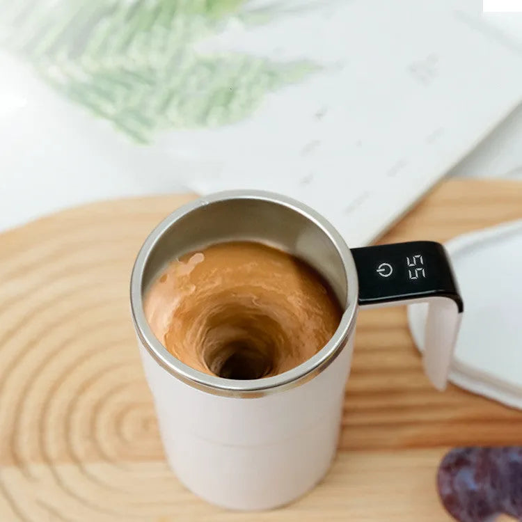 White automatic stirring coffee mug with LCD temperature display and USB charging cable