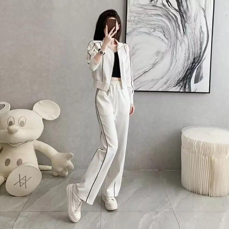 Women's casual two-piece set in white with short zipper sweater and wide leg trousers, polyester fabric, collage stitching