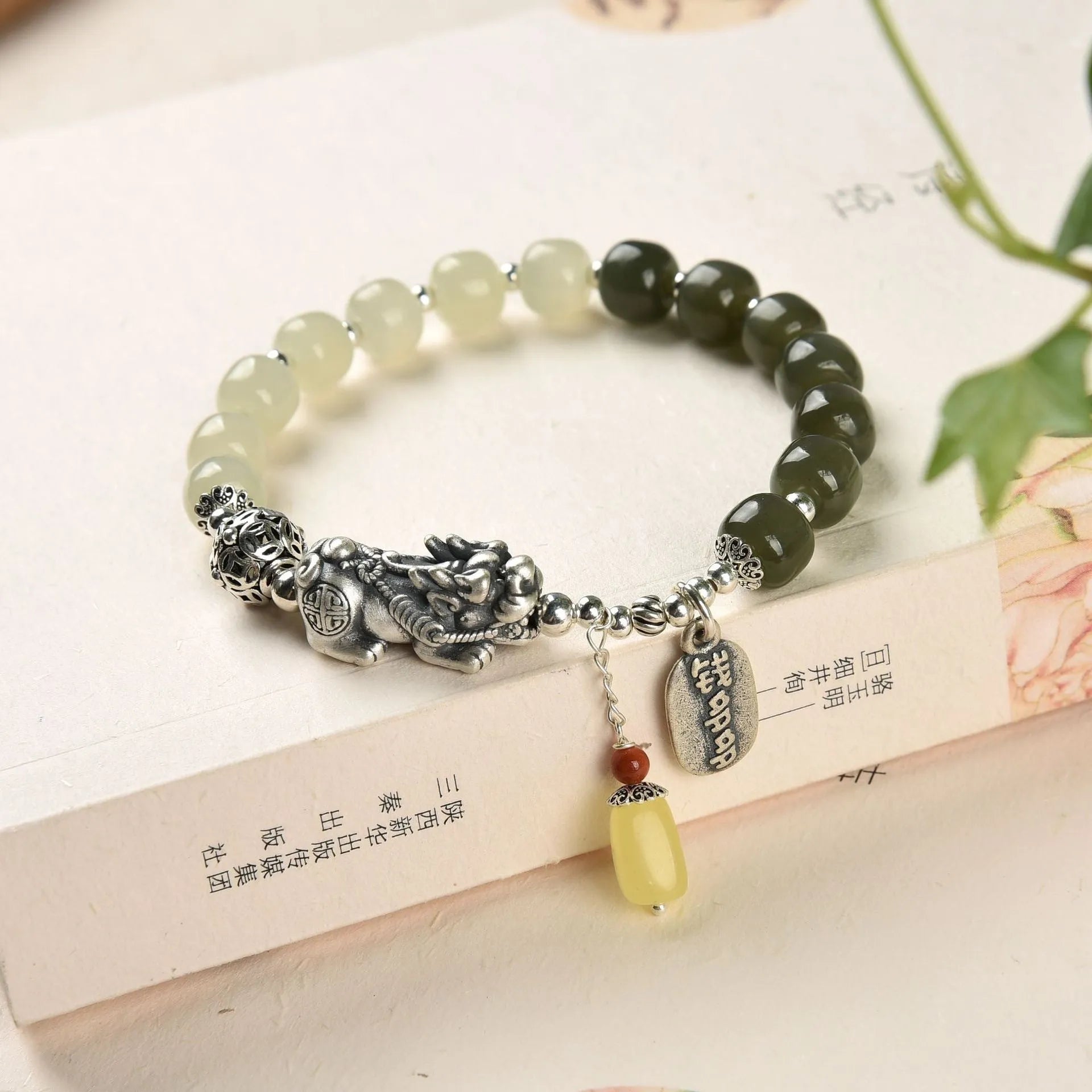 Retro women's pure silver bracelet with a Natural Hetian Jade stone and an 8mm coin charm.