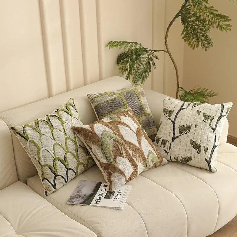 Close-up of a beige and green floral Jacquard woven cushion cover with textured pattern, 45cm square.