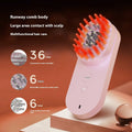 Pink and black smart massage comb with red light therapy for hair care, shown next to a ruler under 10cm.