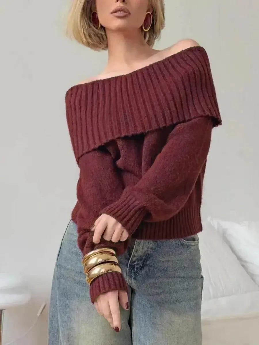 Grey off-the-shoulder strapless women's sweater with a 3D textured pattern.