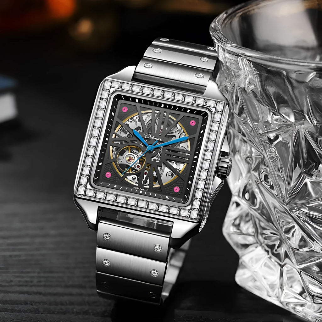 Men's square stainless steel automatic watch with diamond bezel on a black leather strap.
