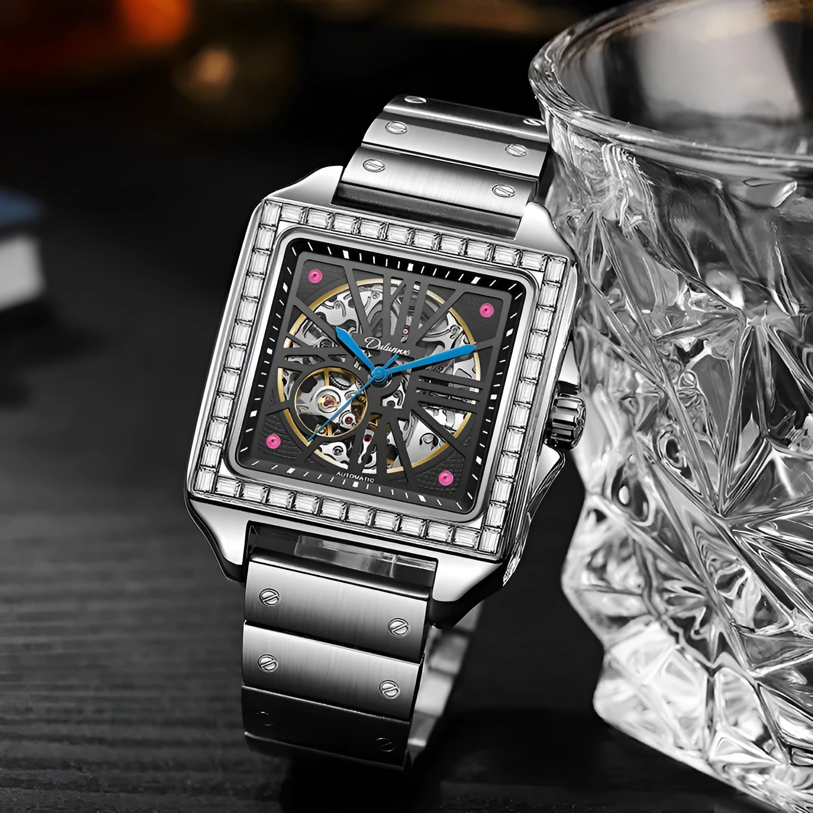 Men's square stainless steel automatic watch with diamond bezel on a black leather strap.