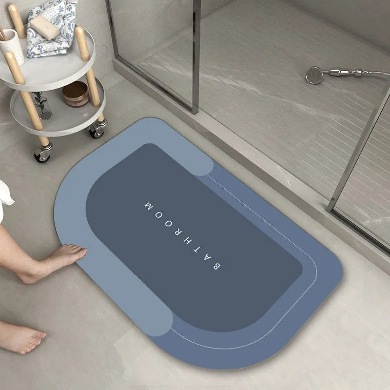 Blended fabric bathroom floor mat in blue, available in oval and rectangular shapes.