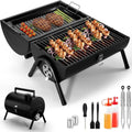 Small black folding desktop charcoal barbecue grill with a metal grill.