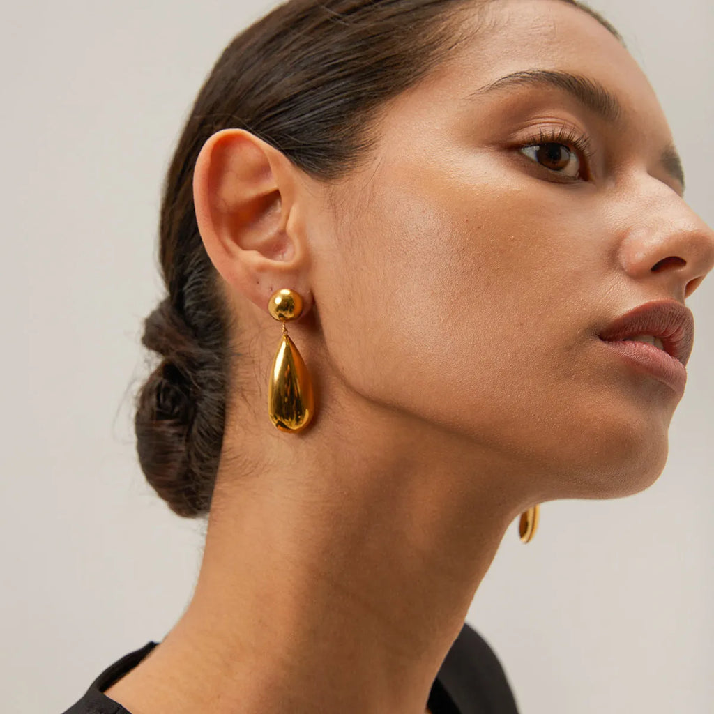 Gold stainless steel water drop pendant earrings with geometric hemisphere design elements