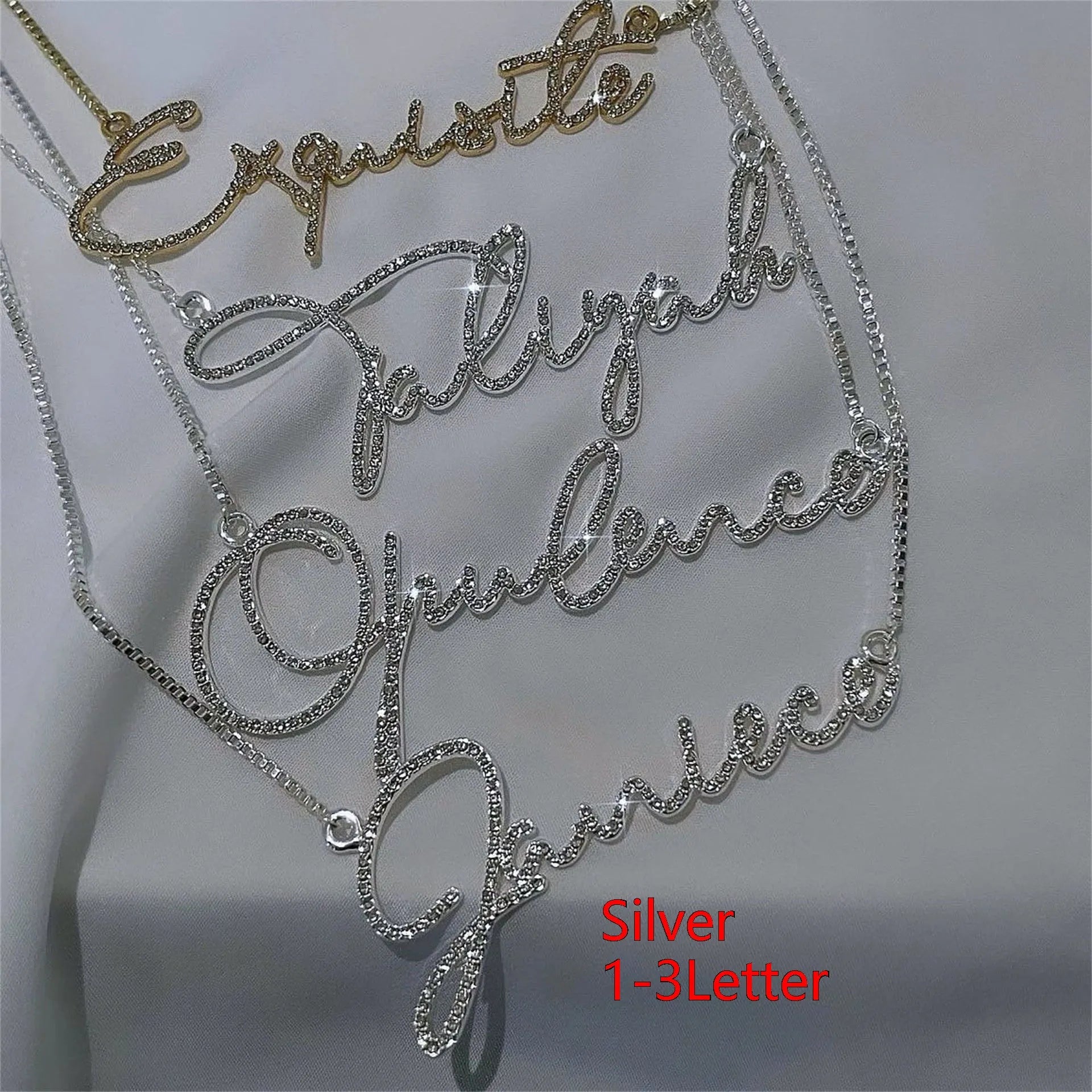 Stainless steel personalised name necklace with diamond studs on a silver chain, showing the letter 'A'.