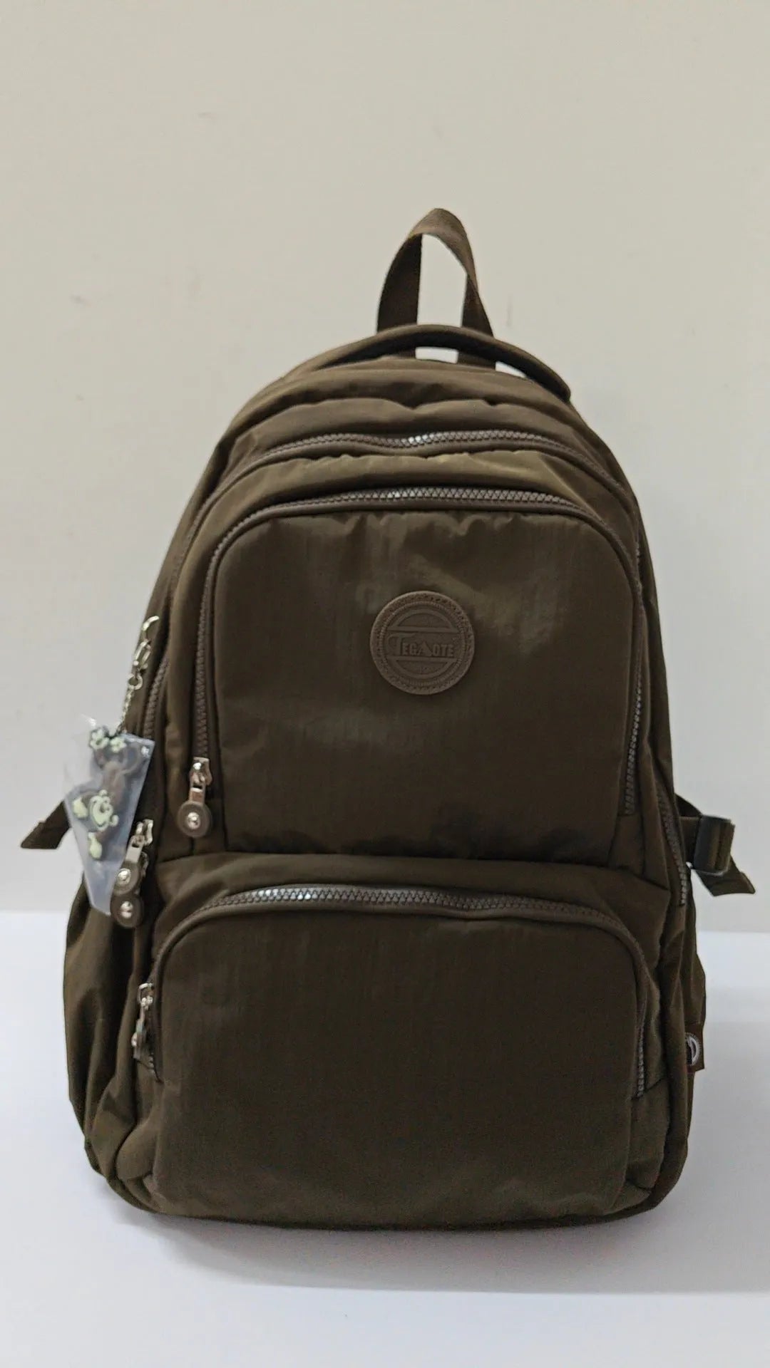 Nylon ultra light outdoor daily travel backpack with curved shoulder straps in olive green colour
