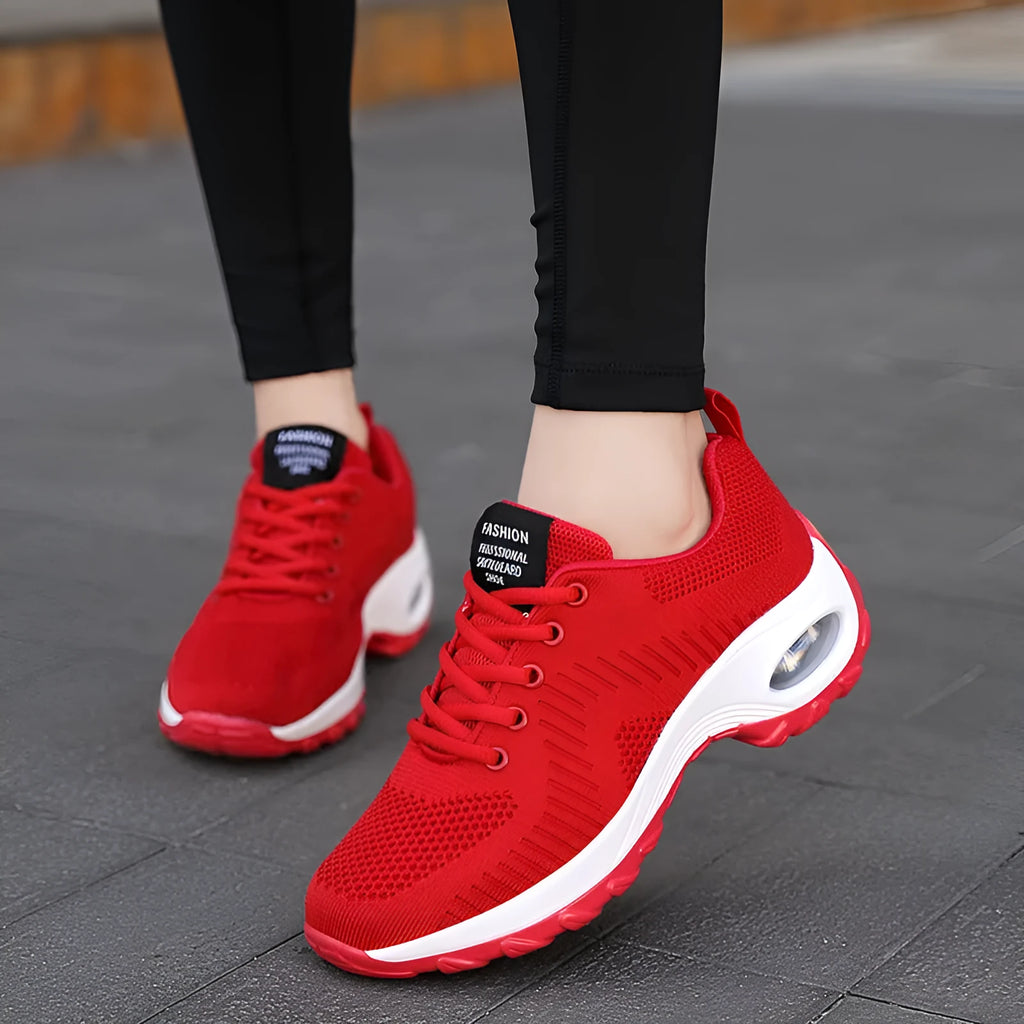 Red and black women's low-top mesh sneakers with front lace-up and a round toe.