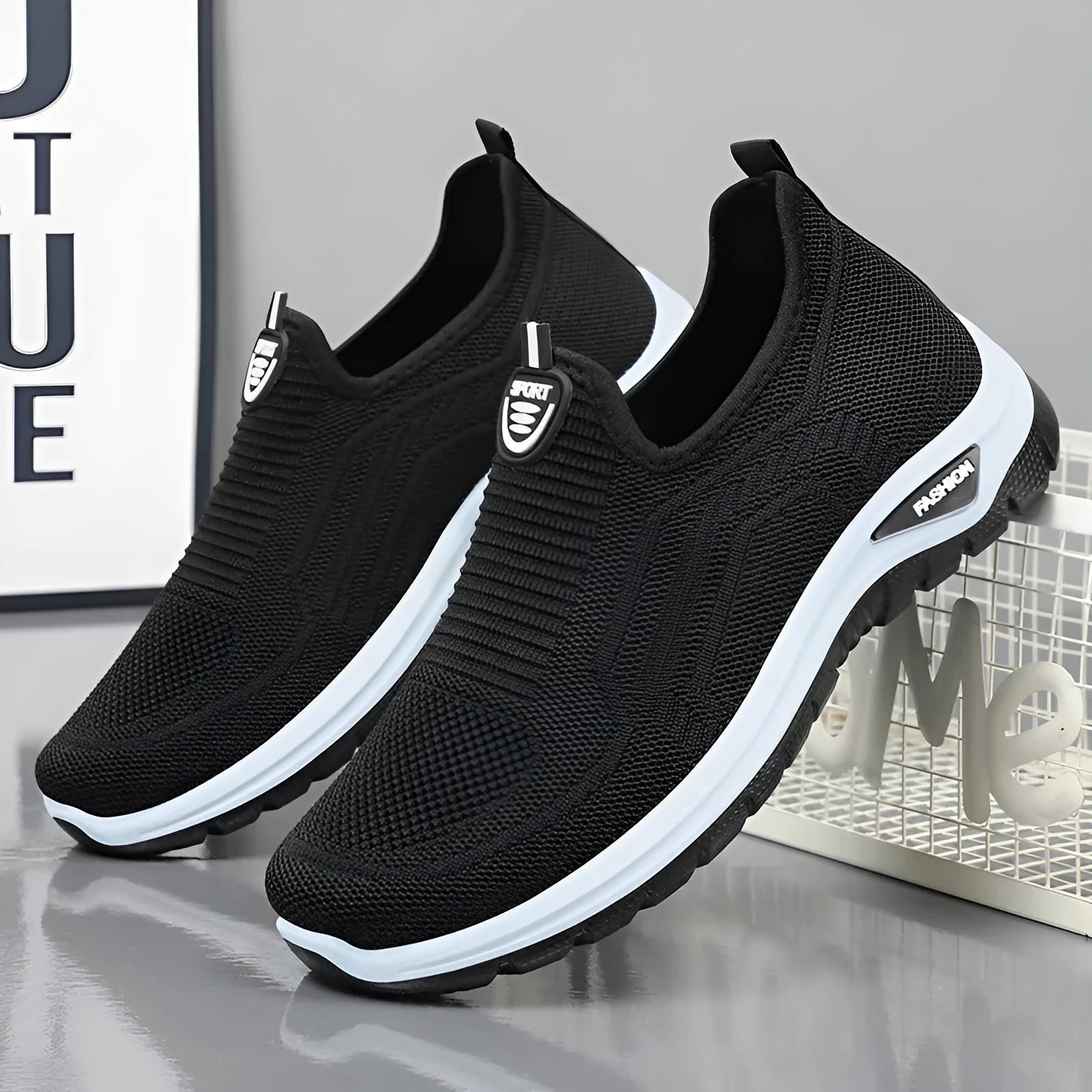 Men's black and grey breathable casual shoes with mesh uppers and PVC soles in a round-toe tennis style.