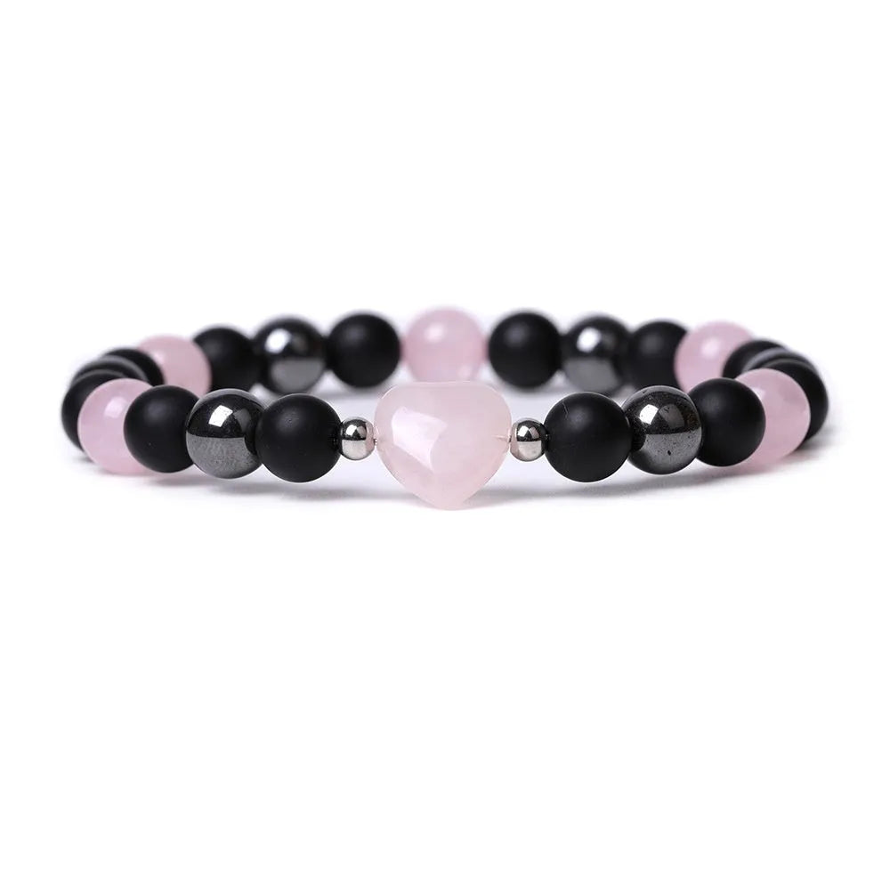 Hand-cut peach heart stone bracelet with geometric universe and moon design in various colours.