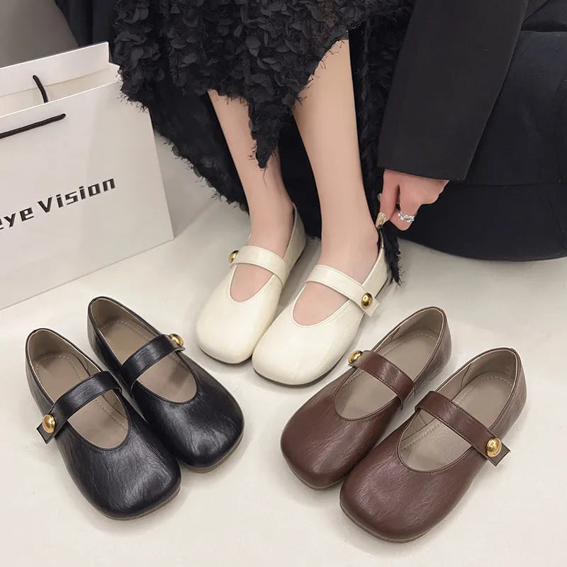 Women's buckle casual leather flat pumps in solid colour with belt buckle, round toe, low top.